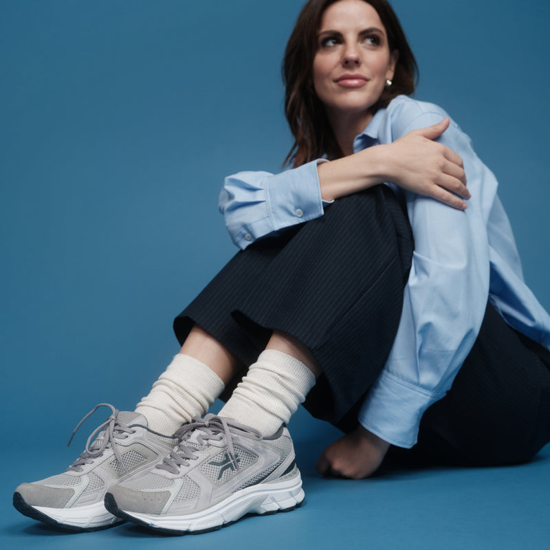 Person wearing the KURU SURGE Unisex Sneaker.