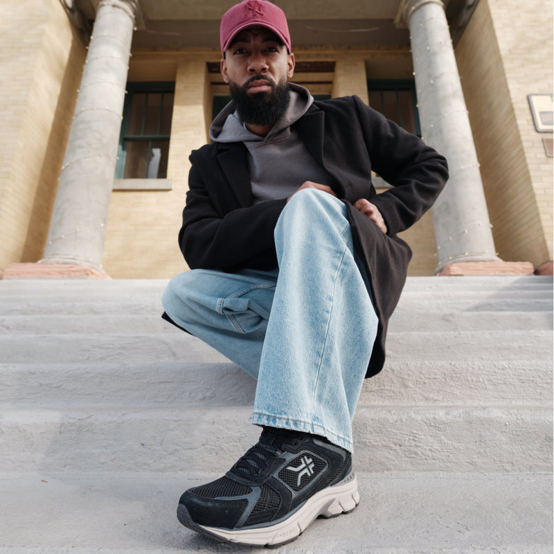 Person wearing the KURU SURGE Unisex Sneaker.