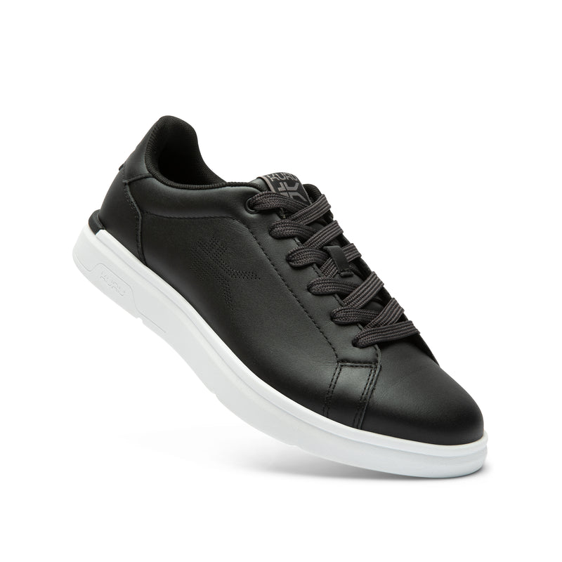 Angled profile view of the KURU ROAM 2 Unisex Sneaker in Jet Black-Bright White.