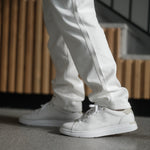 Angled profile view of the KURU ROAM 2 Unisex Sneaker in Bright White-Sand.