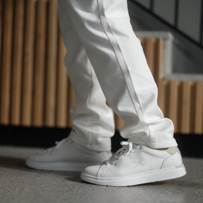 Angled profile view of the KURU ROAM 2 Unisex Sneaker in Bright White-Sand.