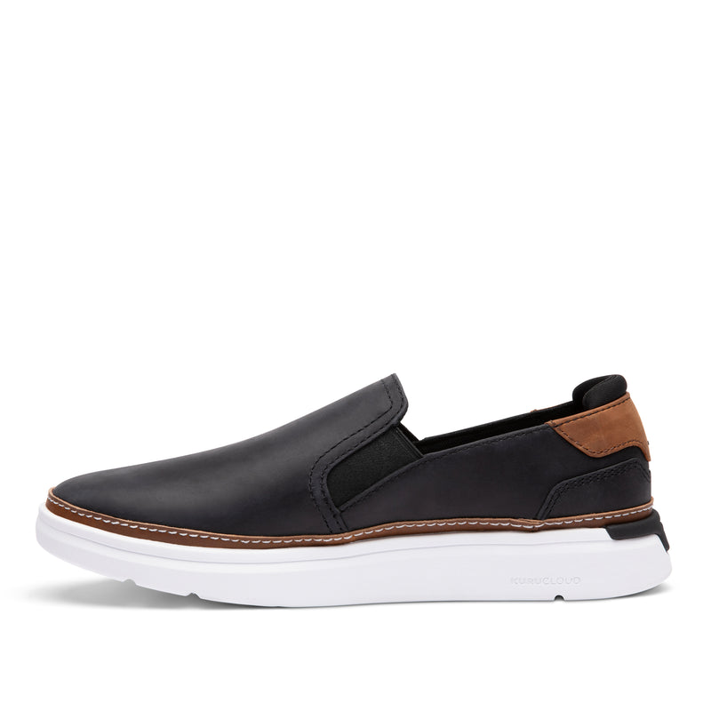 Inner side view of the KURU ROAM 2 Atla Women's Sneaker in Jet Black-Cognac Brown.