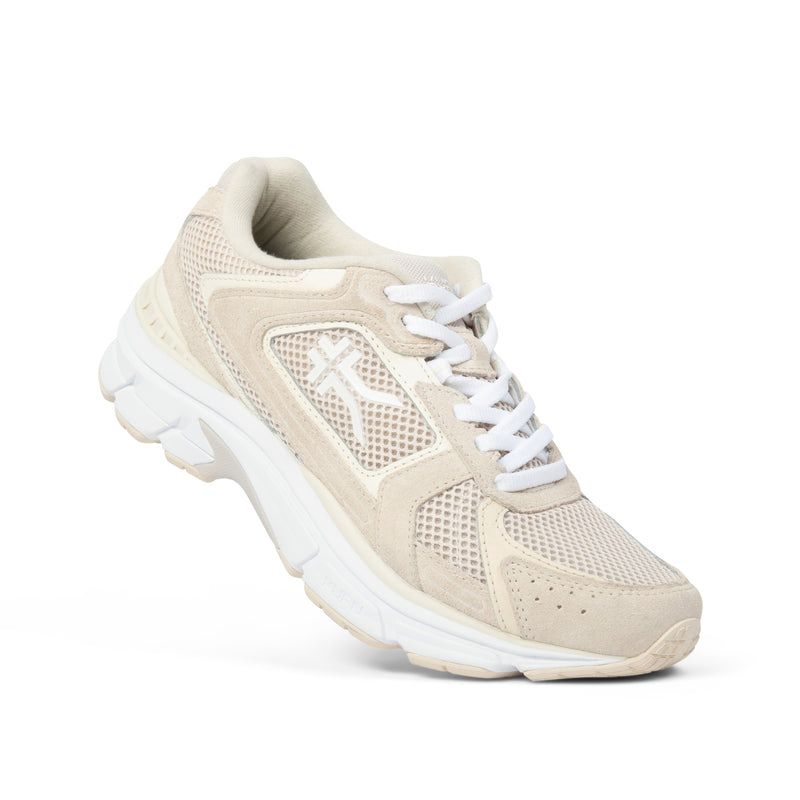 Angled profile view of the KURU SURGE Unisex Sneaker in Ashwood-Bright White.