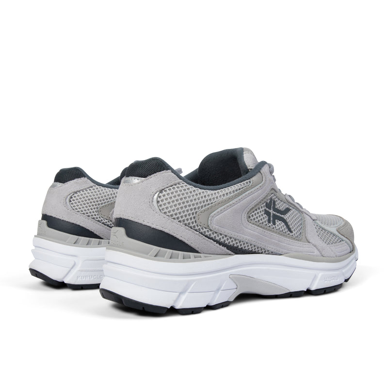 Close-up of the heel cup on the KURU SURGE Unisex Sneaker in Dove Gray-Bright White.