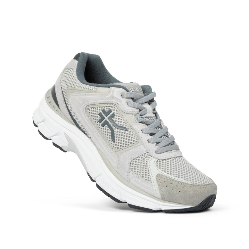 Angled profile view of the KURU SURGE Unisex Sneaker in Dove Gray-Bright White.