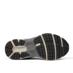 Outsole view of the KURU SURGE Unisex Sneaker in Jet Black-Bone Gray, showing the KURUSOLE tread.