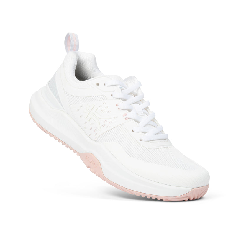 Angled profile view of the KURU VELOCITY Women's Sneaker in Bright White-Lotus Pink.