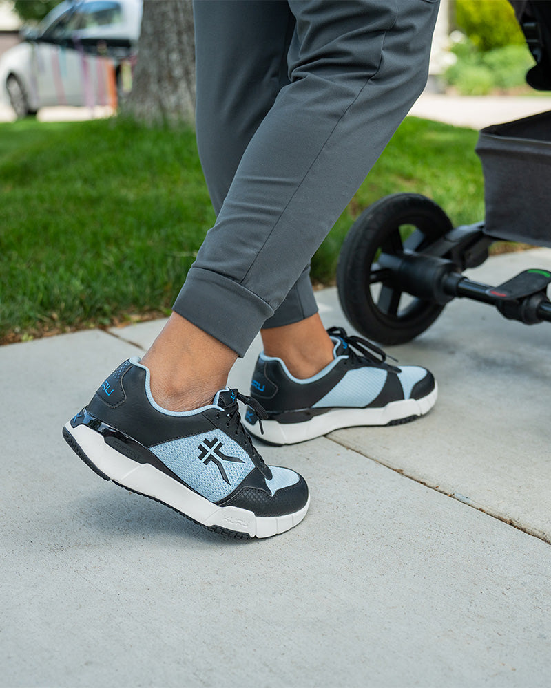KURU QUANTUM Women's fitness shoe in Jet Black and Misty Blue, ideal for workouts and training.