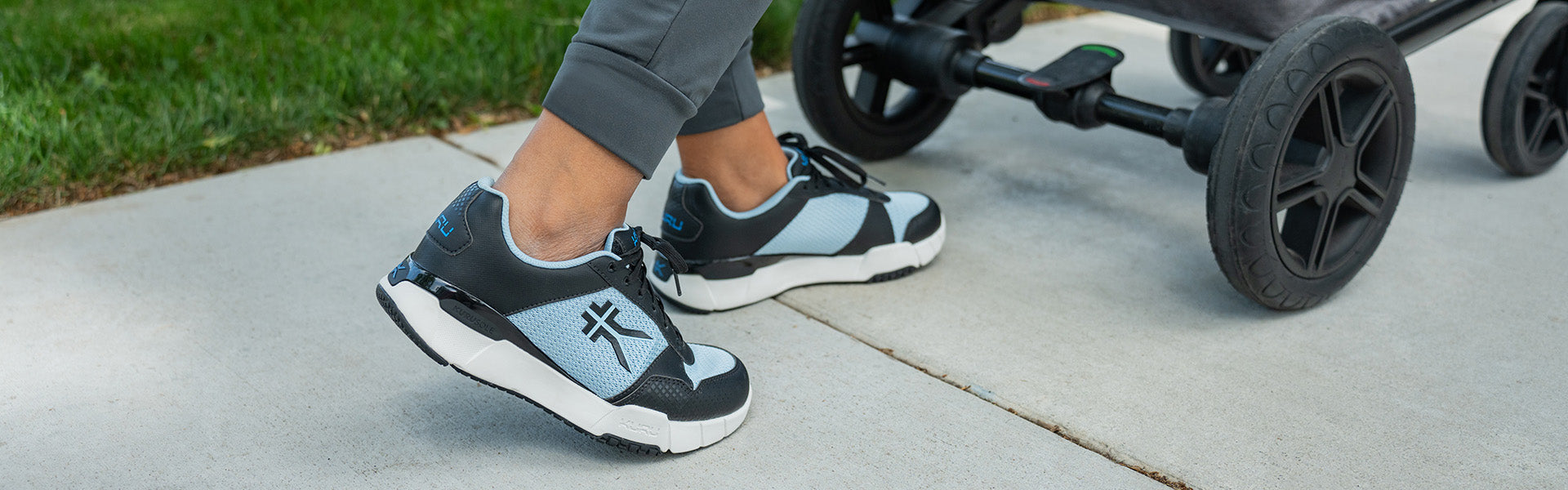 KURU QUANTUM Women's fitness shoe in Jet Black and Misty Blue, ideal for high-impact workouts.