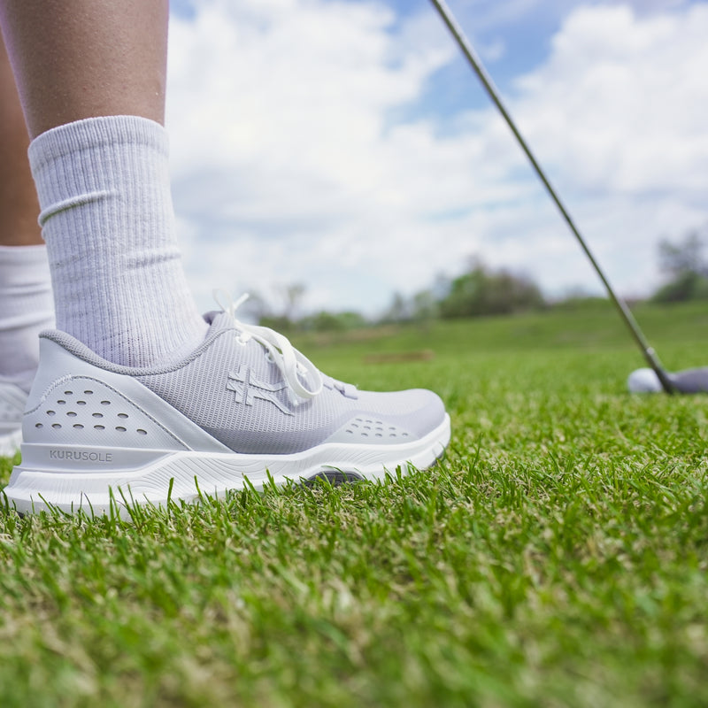 Back heel view of the KURU DRIVE Golf Unisex Golf Shoe in Dove Gray-Bright White.